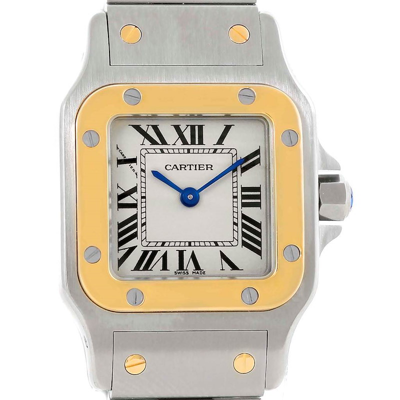 The image shows a front view of the Cartier Santos model watch, highlighting its silver and gold bezel with a Roman numeral dial.