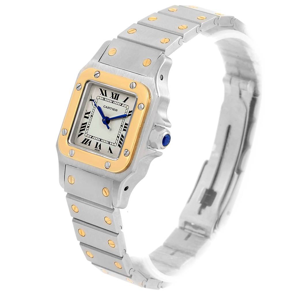 The photo shows a Cartier Santos 166930 Women
s Stainless Steel Silver Dial 166930 Women
s Stainless Steel Silver Dial watch at an angle highlighting its square face, bezel, and bracelet.