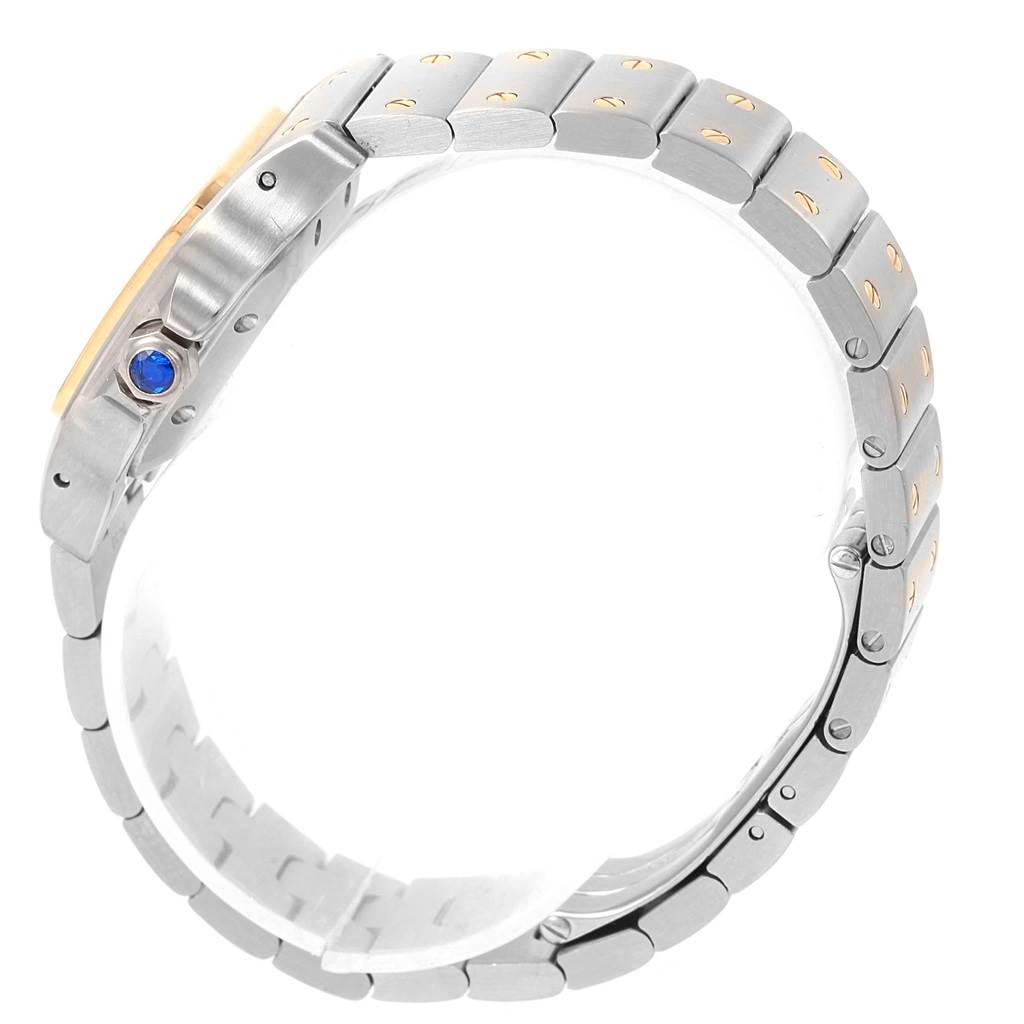 The image shows a Cartier Santos W20057C4 Women's Stainless Steel Silver Dial W20057C4 Women's Stainless Steel Silver Dial watch from a side angle, highlighting its metal bracelet and blue cabochon crown.