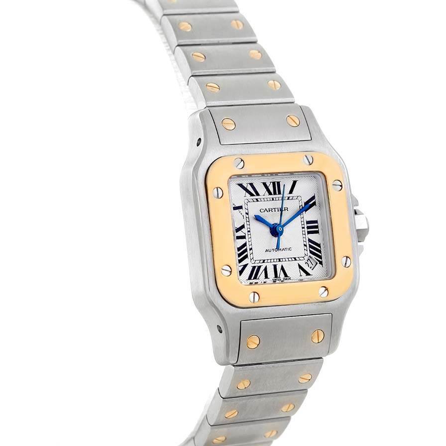 The image shows a Cartier Santos W20057C4 Women's Stainless Steel Silver Dial W20057C4 Women's Stainless Steel Silver Dial watch at an angled side view, highlighting its face, bezel, and bracelet.