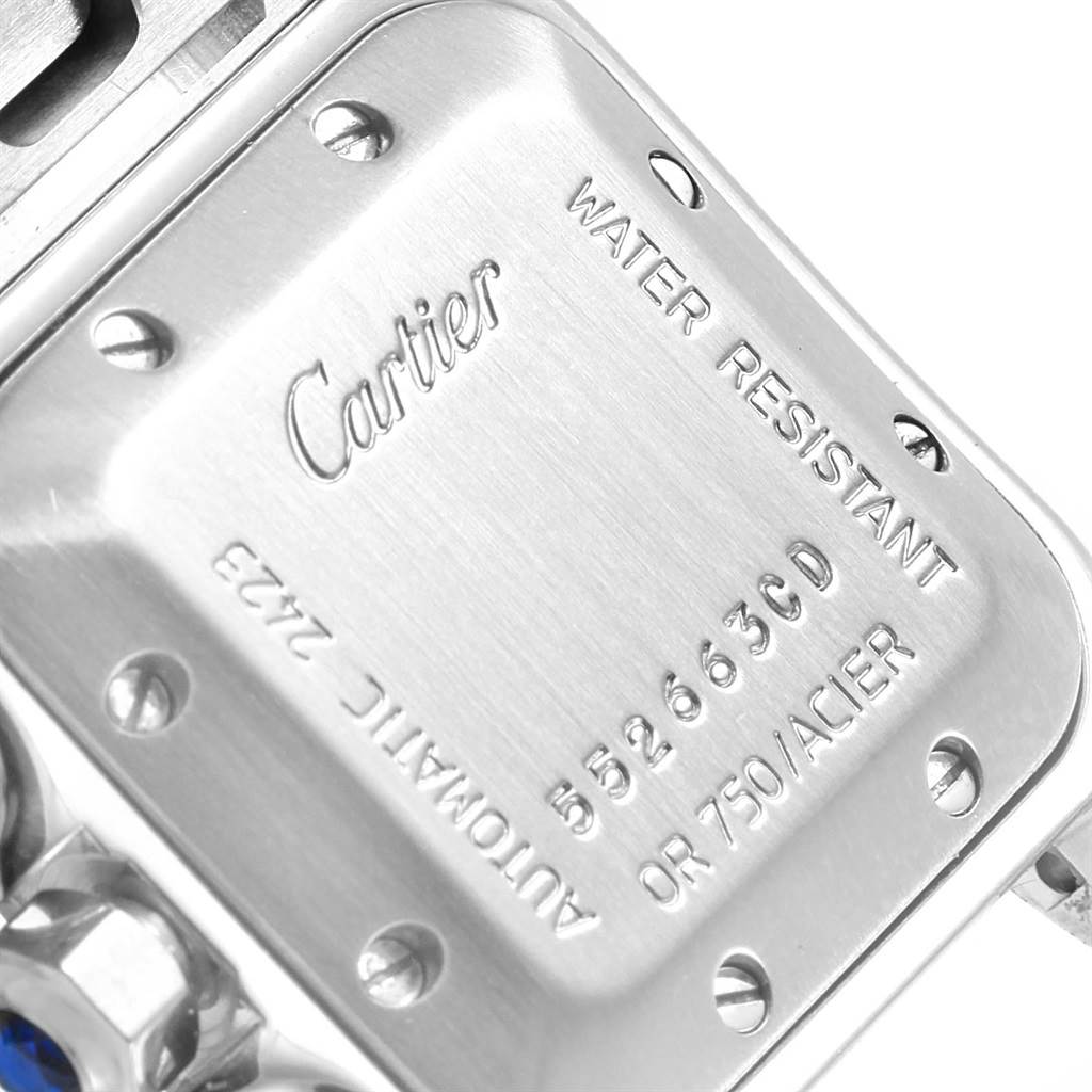 The image shows the back case and part of the crown of the Cartier Santos W20057C4 Women's Stainless Steel Silver Dial W20057C4 Women's Stainless Steel Silver Dial watch.