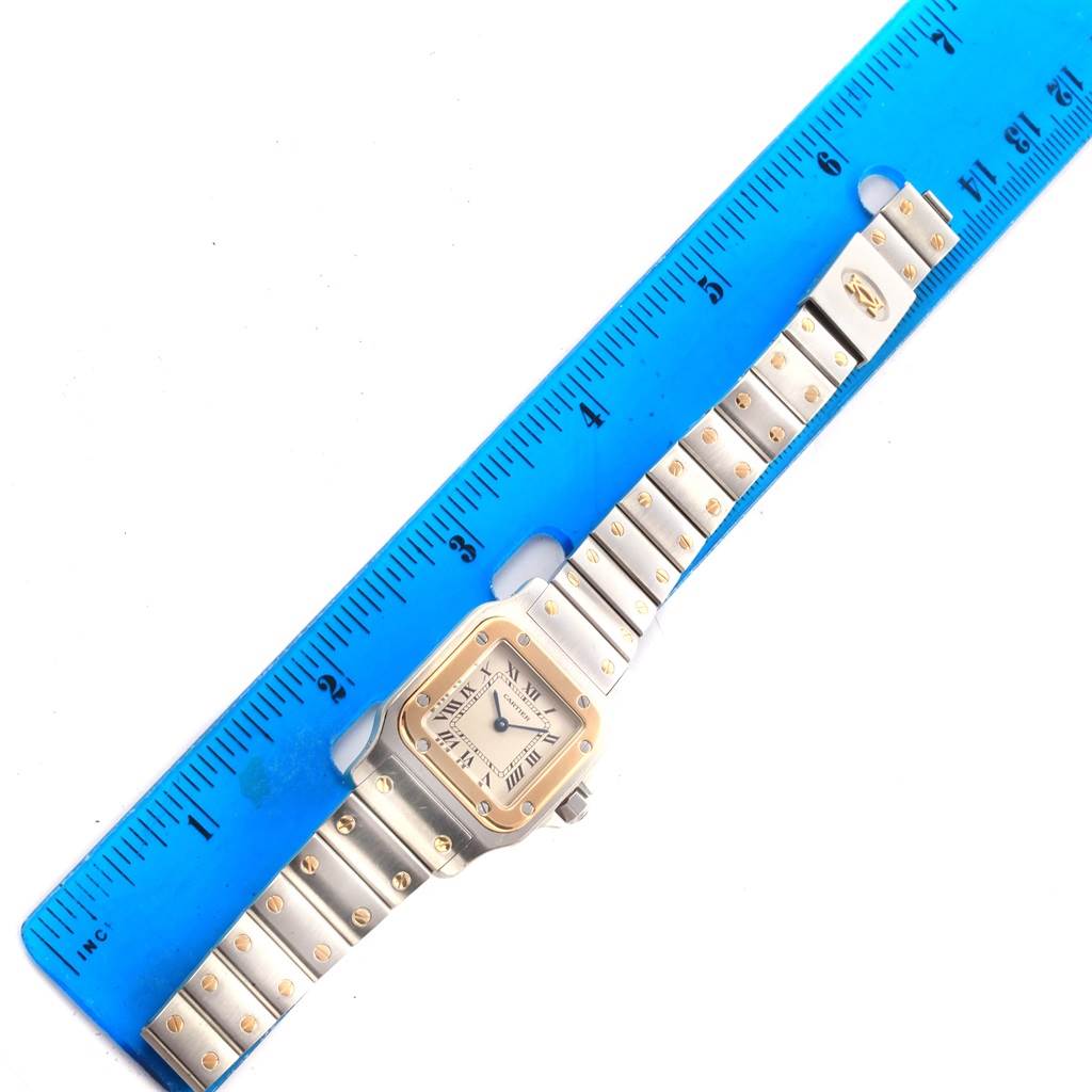 The angle shows the entire Cartier Santos 41010 Women's Stainless Steel Silver Dial 41010 Women's Stainless Steel Silver Dial model watch, with the ruler measuring the length of the bracelet.