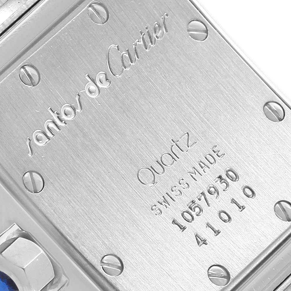 The image shows the back case of a Cartier Santos 41010 Women's Stainless Steel Silver Dial 41010 Women's Stainless Steel Silver Dial watch, featuring engraved details and screws.