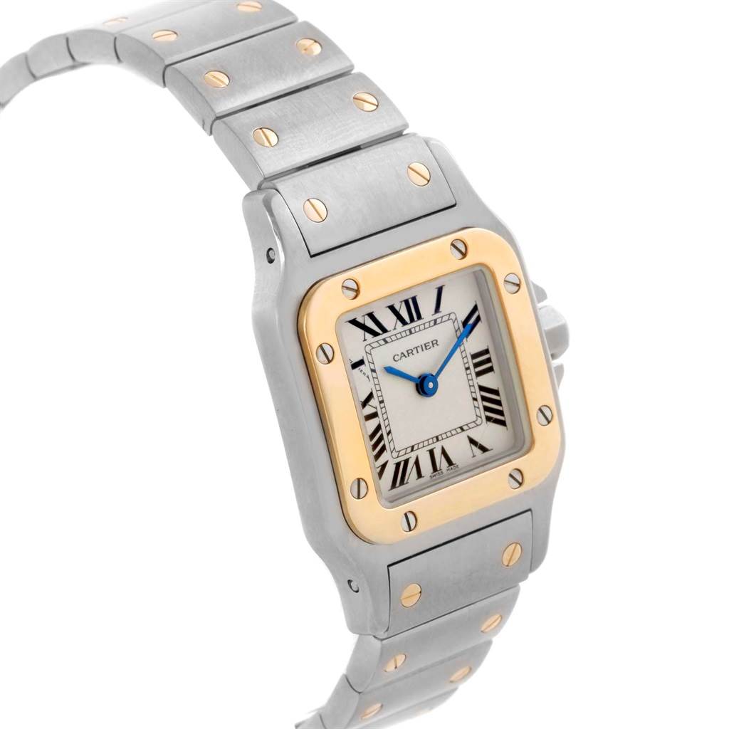 The image shows a Cartier Santos W20012C4 Women's Stainless Steel Silver Dial W20012C4 Women's Stainless Steel Silver Dial watch at a slight angle, highlighting its face, bezel, and metal strap with gold accents.