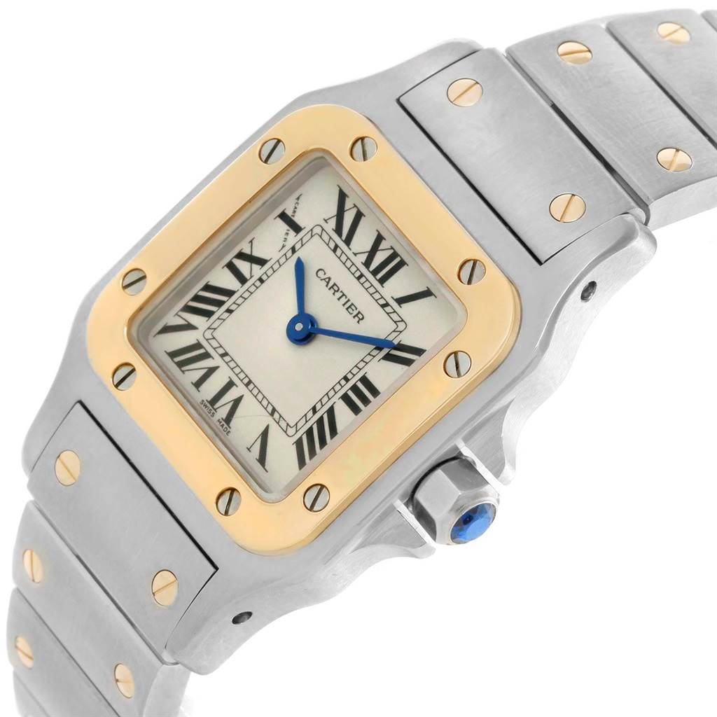 This image shows a close-up of the dial, bezel, and part of the bracelet of a Cartier Santos W20012C4 Women's Stainless Steel Silver Dial W20012C4 Women's Stainless Steel Silver Dial watch.