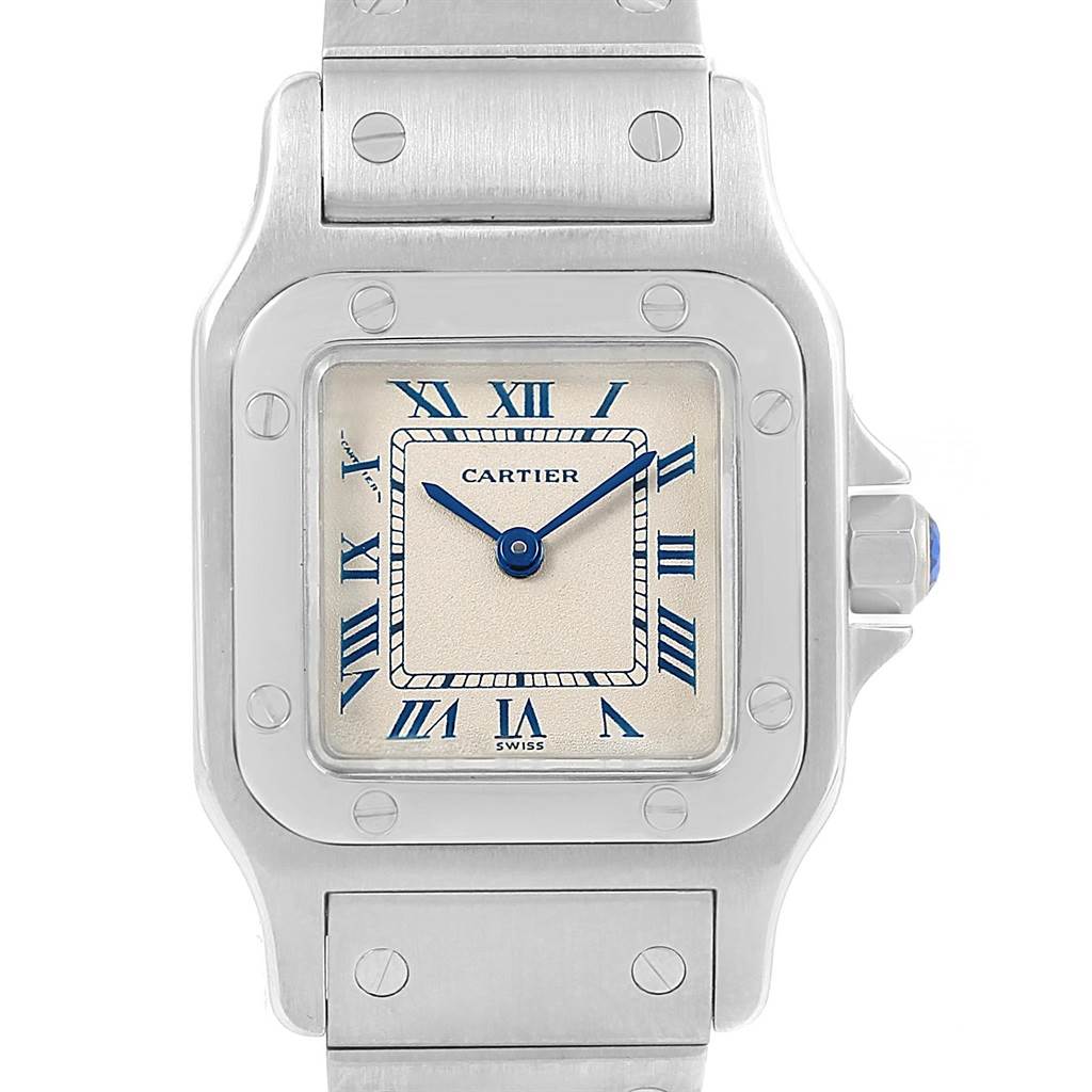 The image shows a front view of the Cartier Santos 07791 Women's Stainless Steel Silver Dial 07791 Women's Stainless Steel Silver Dial watch, highlighting the face, blue hands, and part of the bracelet.