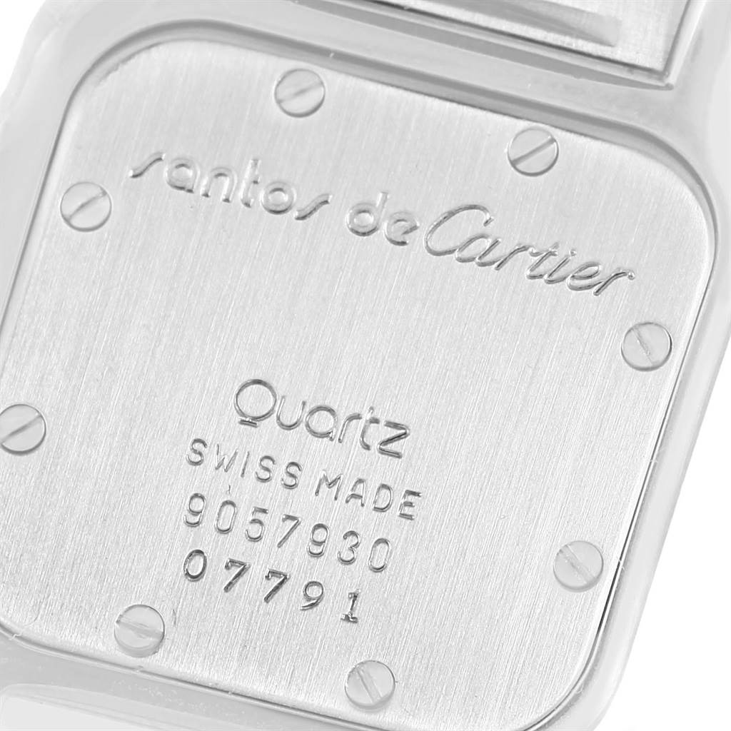 This image shows the back case of a Cartier Santos 07791 Women's Stainless Steel Silver Dial 07791 Women's Stainless Steel Silver Dial watch, displaying the brand name, model, and serial number.