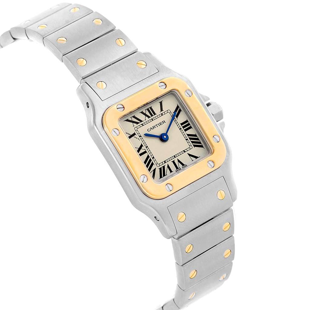 The Cartier Santos W20012C4 Women's Stainless Steel Silver Dial W20012C4 Women's Stainless Steel Silver Dial watch is shown at a slight angle, highlighting the face, bezel, bracelet, and screws.