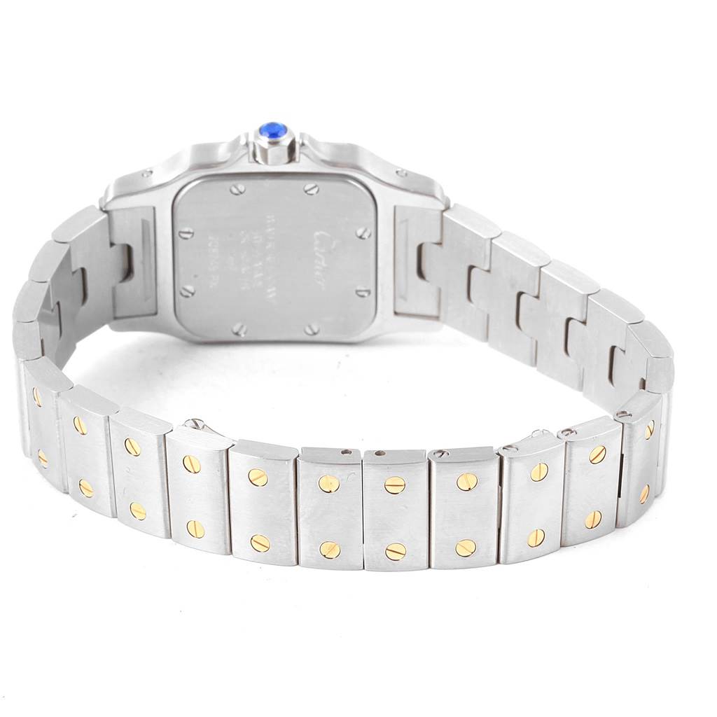 The image shows the back case and bracelet of a Cartier Santos W20012C4 Women's Stainless Steel Silver Dial W20012C4 Women's Stainless Steel Silver Dial watch, highlighting the screws and links.