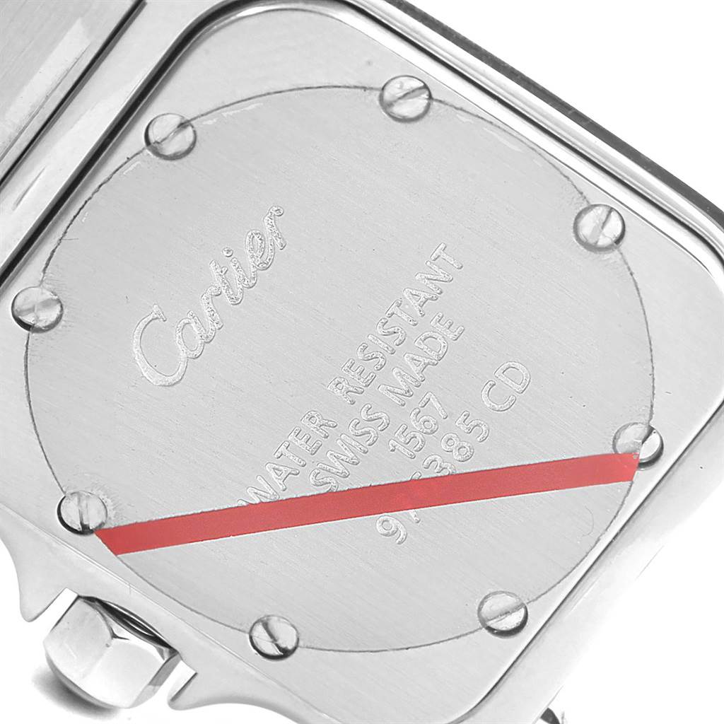 This image shows the back case of a Cartier Santos W20012C4 Women's Stainless Steel Silver Dial W20012C4 Women's Stainless Steel Silver Dial watch, focusing on the engraved details and screws.