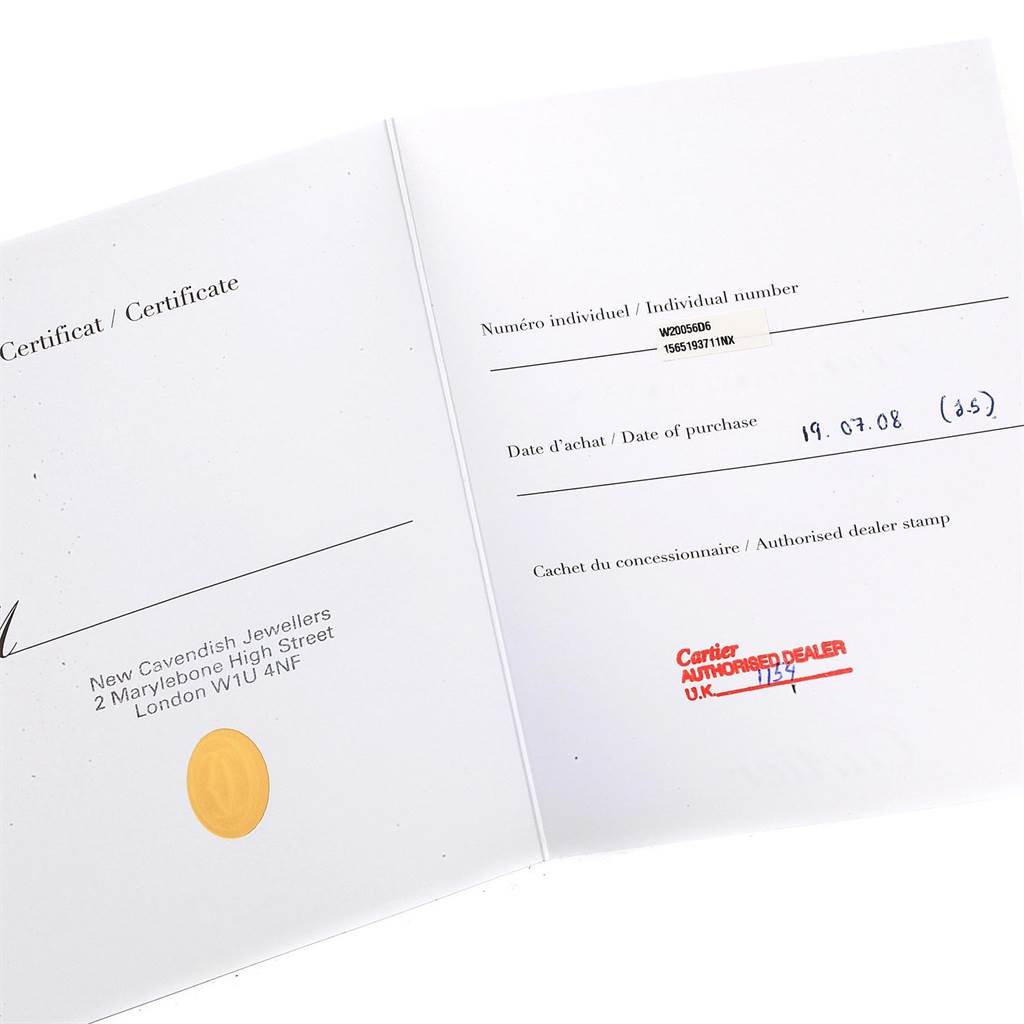 The image shows an opened certificate for the Cartier Santos W20056D6 Women's Stainless Steel Silver Dial W20056D6 Women's Stainless Steel Silver Dial model watch, with individual number, purchase date, and dealer stamp.