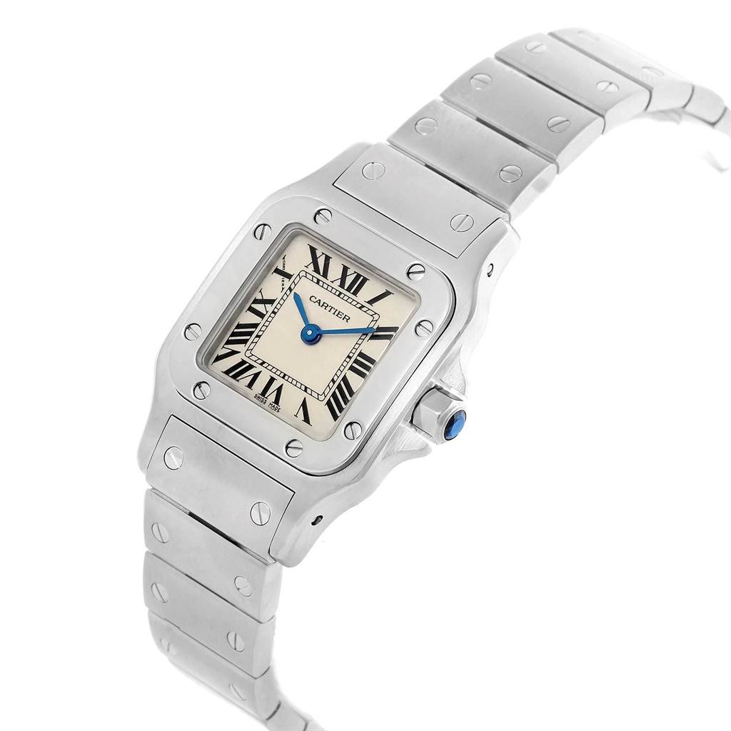 This image shows a Cartier Santos W20056D6 Women's Stainless Steel Silver Dial W20056D6 Women's Stainless Steel Silver Dial watch angled to display the face, bezel, crown, and part of the metal bracelet.
