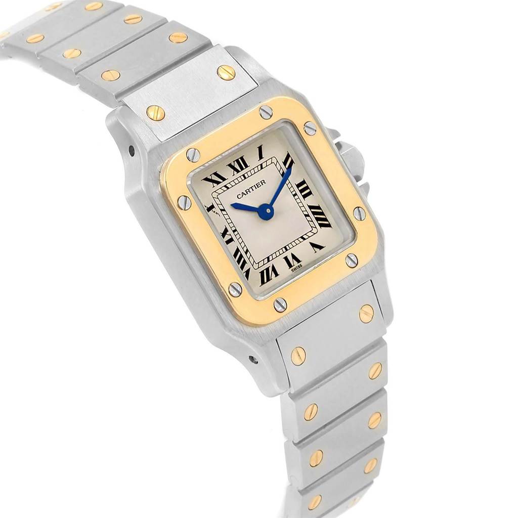 The Cartier Santos 1567 Women's Stainless Steel Silver Dial 1567 Women's Stainless Steel Silver Dial watch is shown from an angle highlighting the dial, bezel, and part of the bracelet.