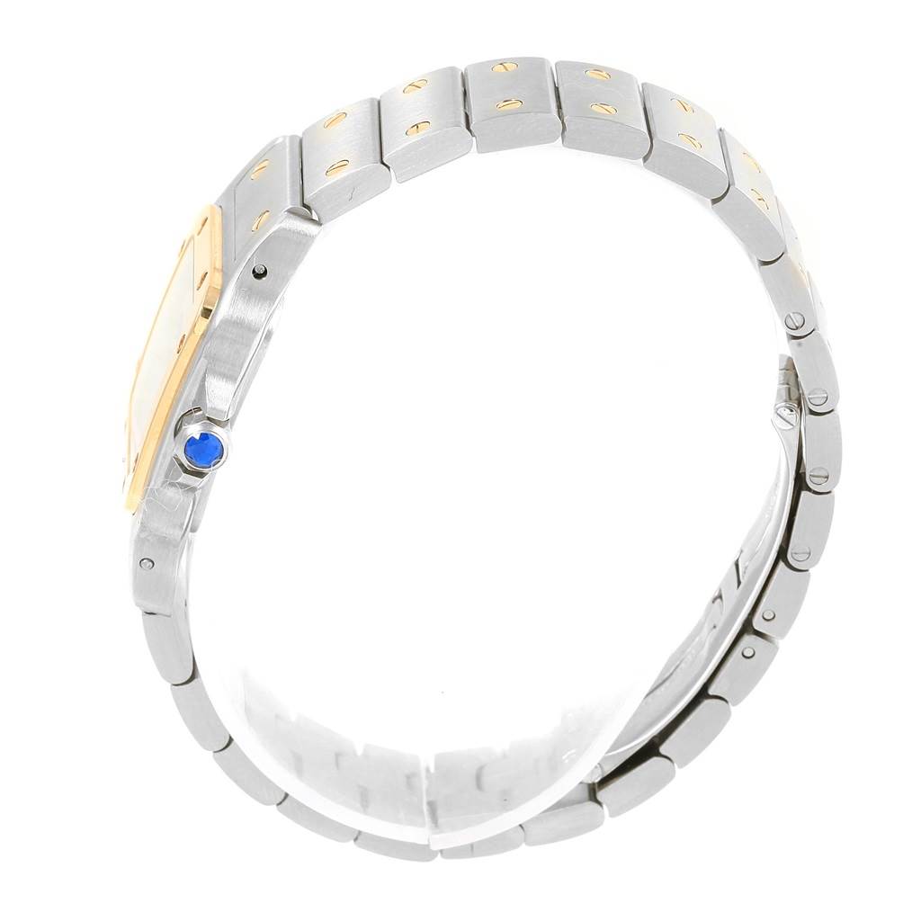 The image shows a side view of a Cartier Santos W20012C4 Women's Stainless Steel Silver Dial W20012C4 Women's Stainless Steel Silver Dial watch, highlighting its bracelet, case, and blue crown.