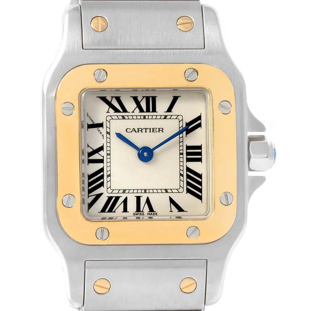 This image shows a frontal view of the Santos by Cartier watch, highlighting the dial, bezel, and part of the bracelet.