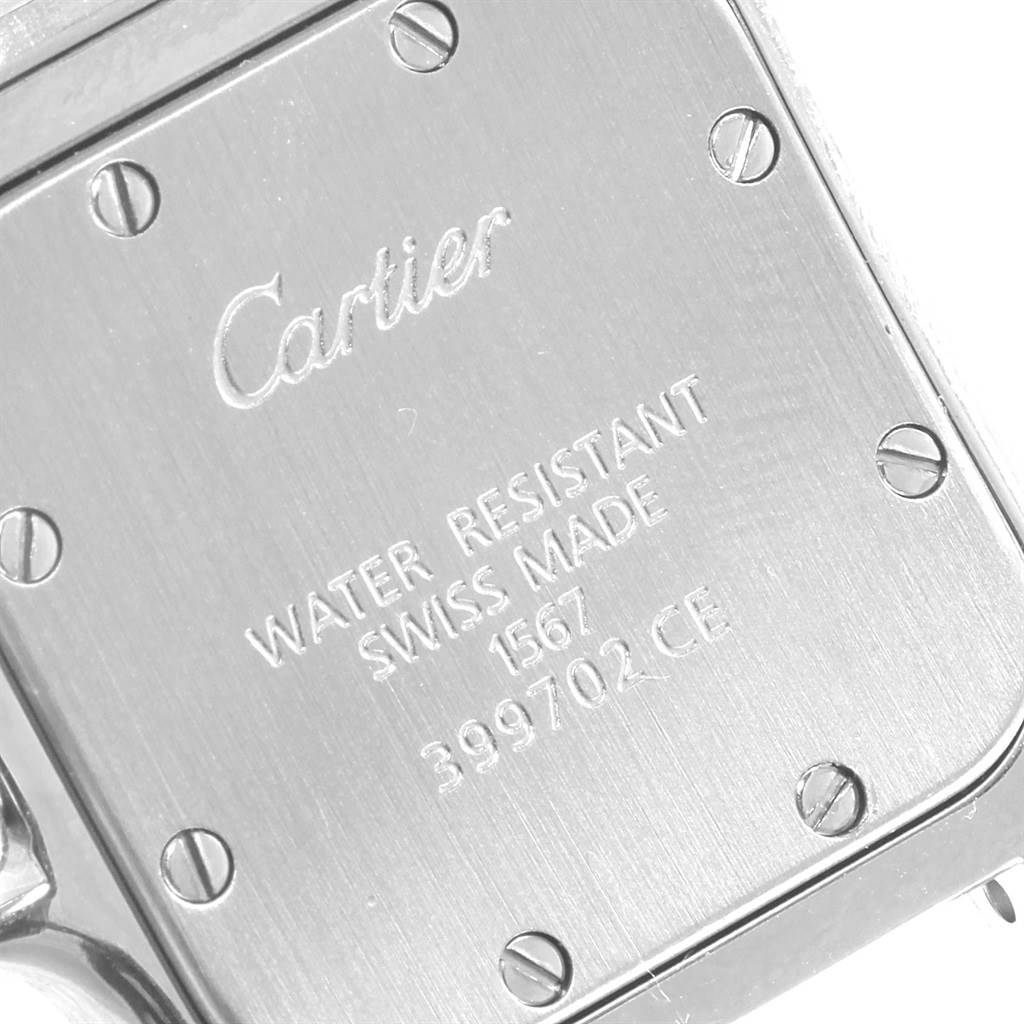 The image shows the back case of a Cartier Santos W20012C4 Women's Stainless Steel Silver Dial W20012C4 Women's Stainless Steel Silver Dial watch, featuring branding, model details, and screw fastenings.