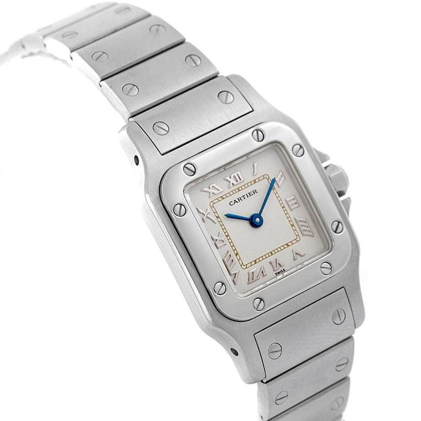 The image shows a Cartier Santos 1565 Women's Stainless Steel Silver Dial 1565 Women's Stainless Steel Silver Dial watch at a slight angle, highlighting its rectangular face, bezel, and metal bracelet.