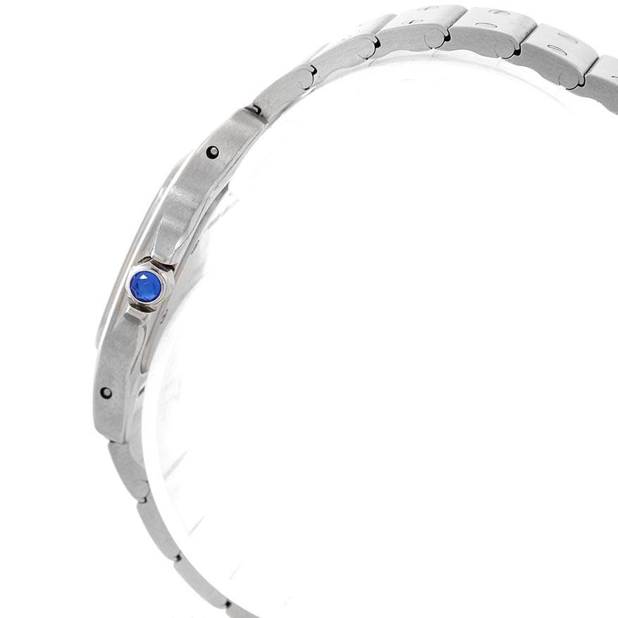 This side view of the Cartier Santos 1565 Women's Stainless Steel Silver Dial 1565 Women's Stainless Steel Silver Dial watch shows the bracelet and crown with a blue cabochon.