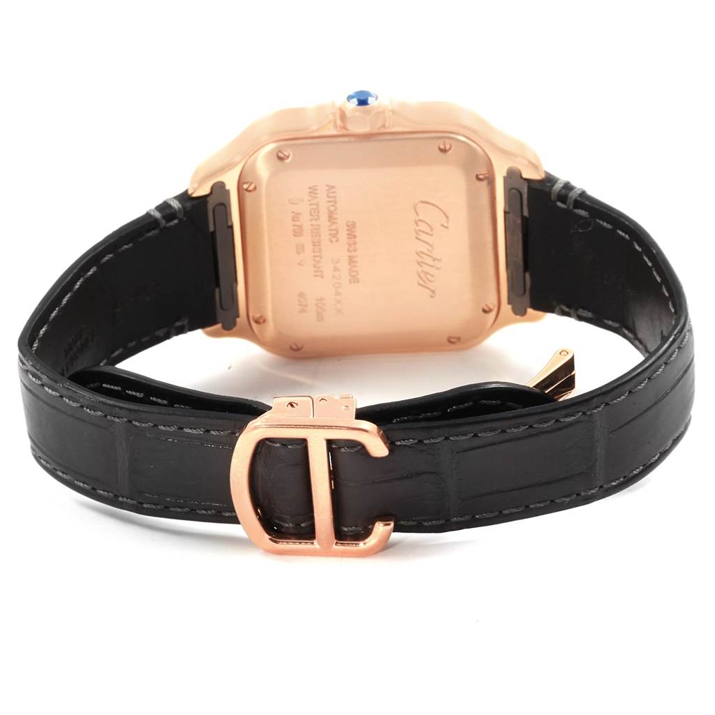 This image shows the back view of a Cartier Santos WGSA0012 Women's Rose Gold Silver Dial WGSA0012 Women's Rose Gold Silver Dial watch with a leather strap and rose gold buckle.