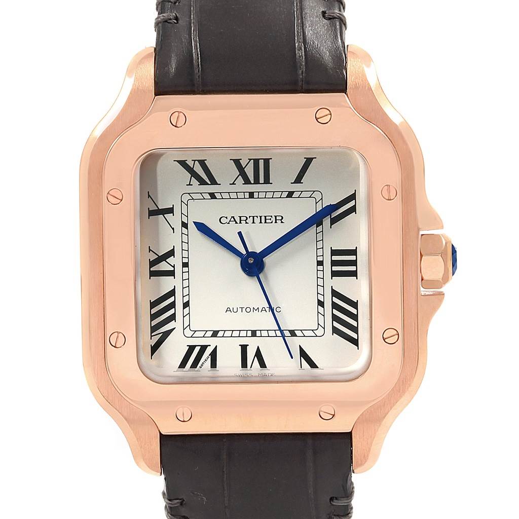 The image shows a front view of the Cartier Santos WGSA0012 Women's Rose Gold Silver Dial WGSA0012 Women's Rose Gold Silver Dial watch, featuring its square face, Roman numerals, and leather strap.