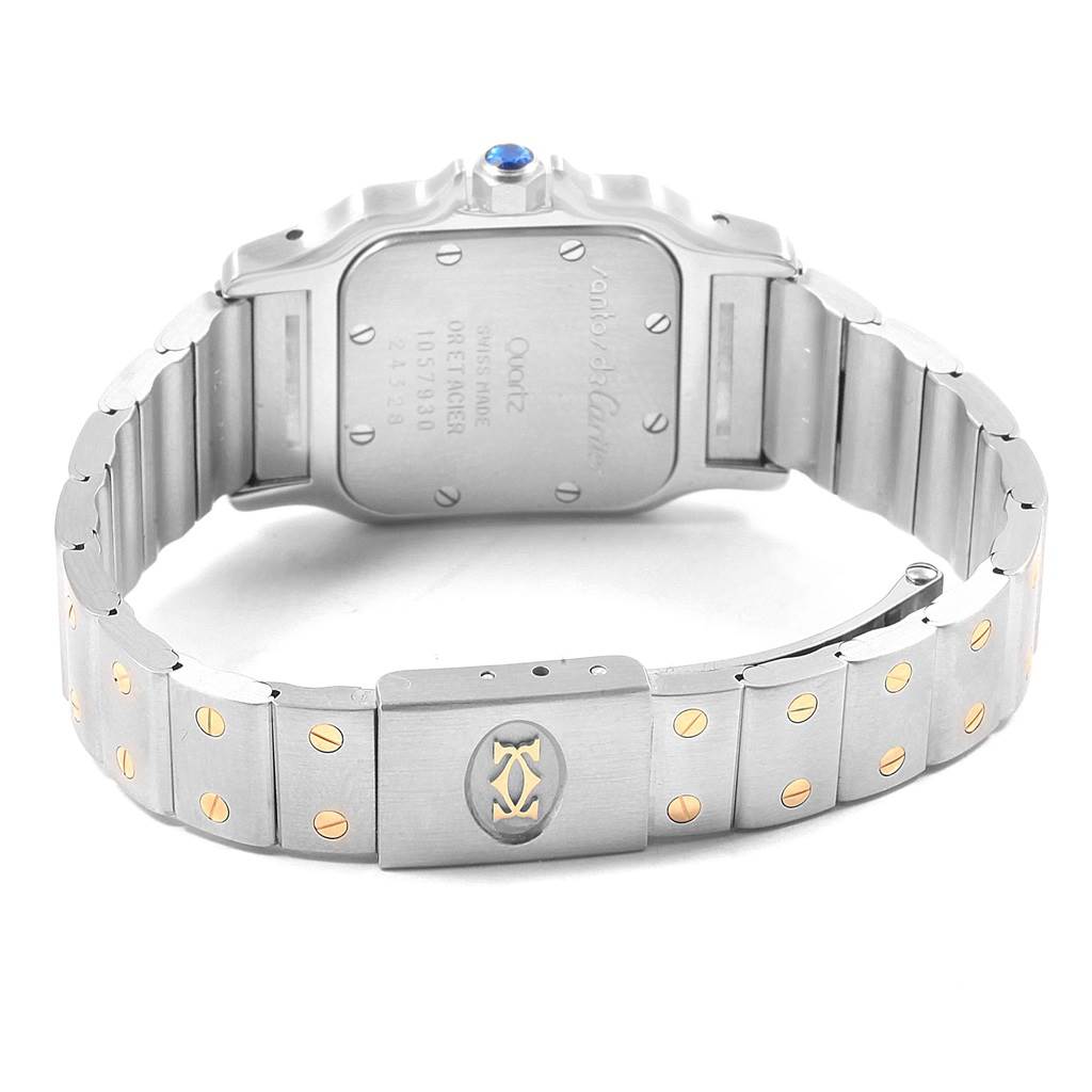 This image shows the back of the watch case and the metal bracelet of a Santos model by Cartier.