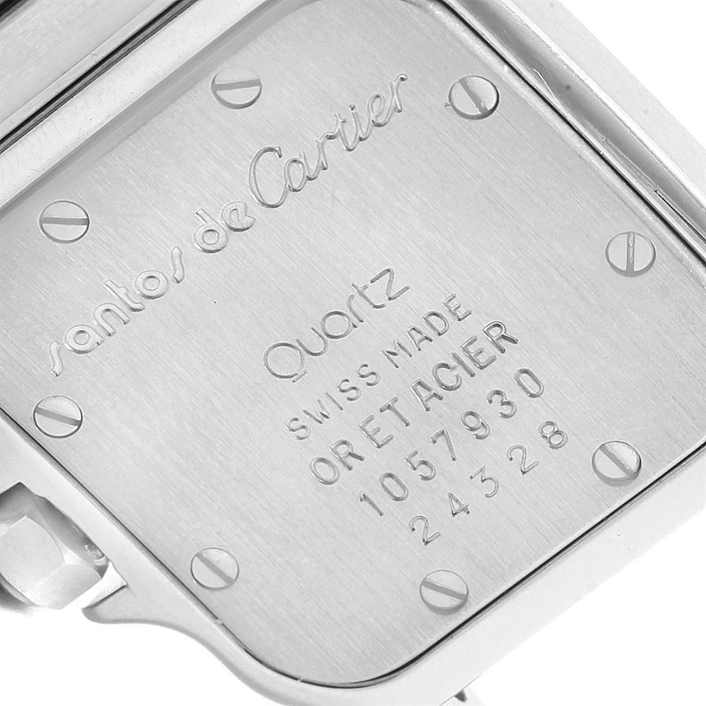 The image shows the back case of a Cartier Santos 1057930 Women's Stainless Steel Silver Dial 1057930 Women's Stainless Steel Silver Dial Quartz watch, highlighting the engravings and screws.