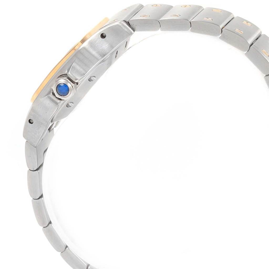 The image shows a side view of the strap and crown of a Santos model watch by Cartier.