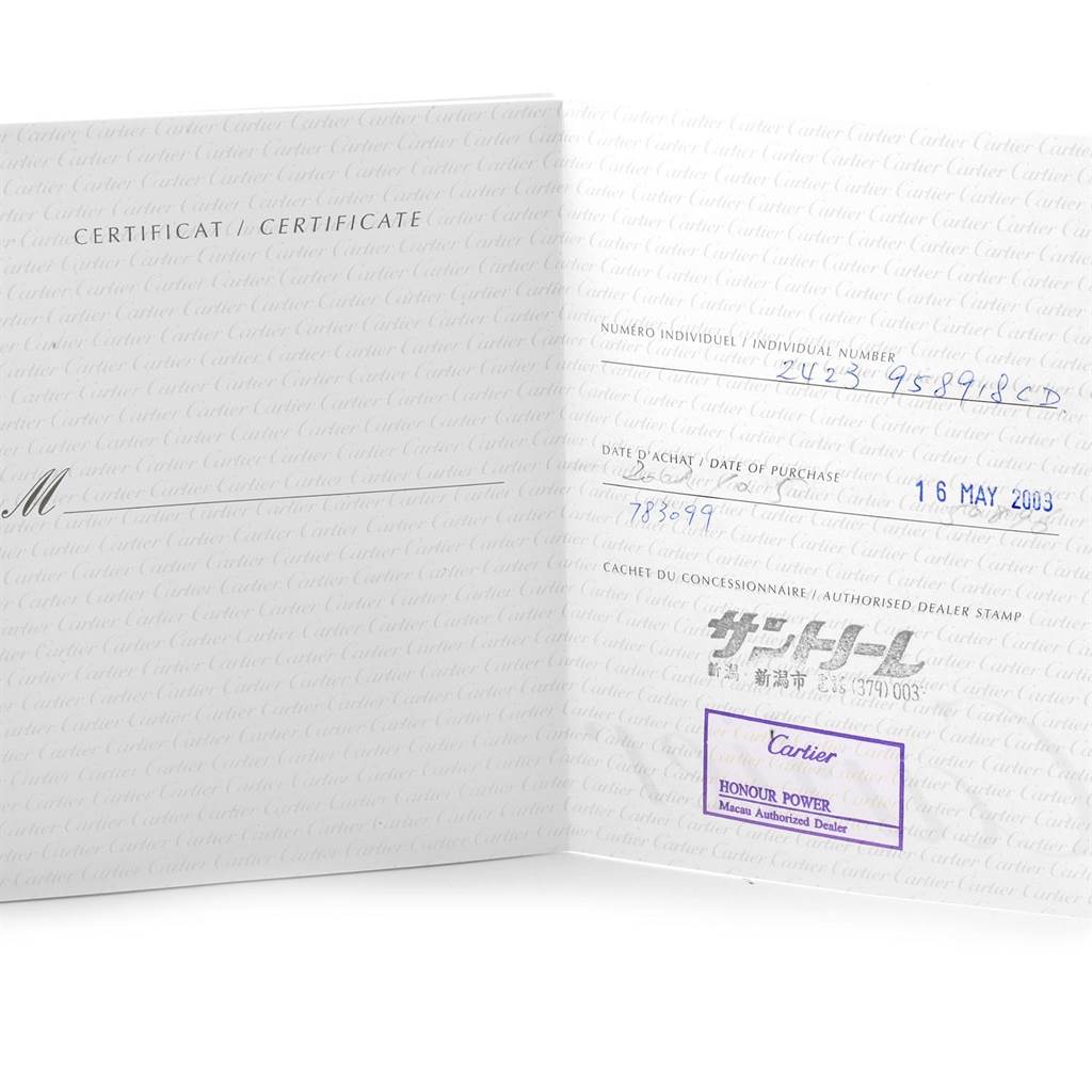 This image shows a close-up of an open certificate book for a Cartier Santos W20057C4 Women's Stainless Steel Silver Dial W20057C4 Women's Stainless Steel Silver Dial watch.