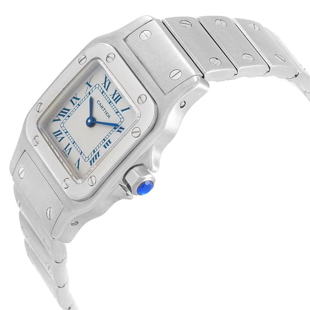 The image shows a side angle of the Cartier Santos 04278 Women's Silver Dial 04278 Women's Silver Dial watch, highlighting the face, bezel, crown, and part of the bracelet.