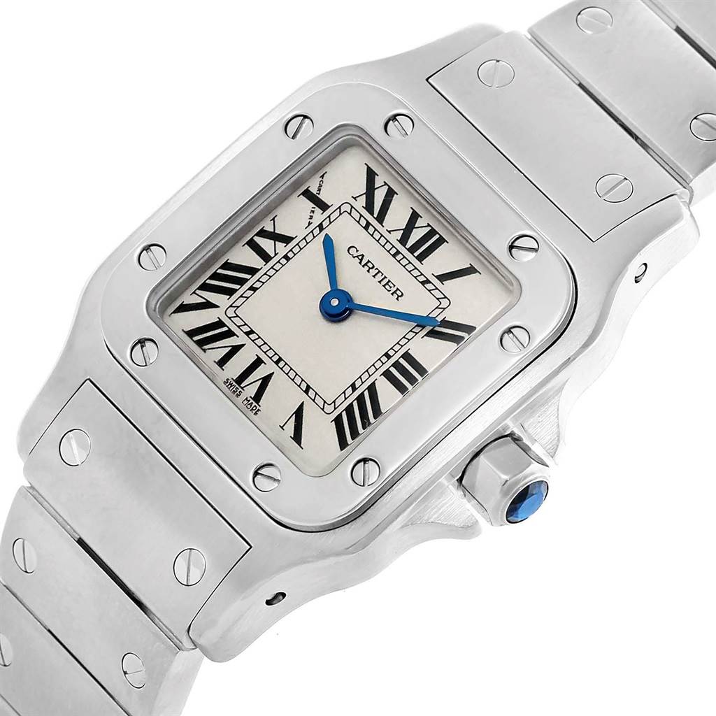 The image shows a close-up angle of the Cartier Santos W20056D6 Women's Stainless Steel Silver Dial W20056D6 Women's Stainless Steel Silver Dial watch face, bezel, and part of the bracelet.