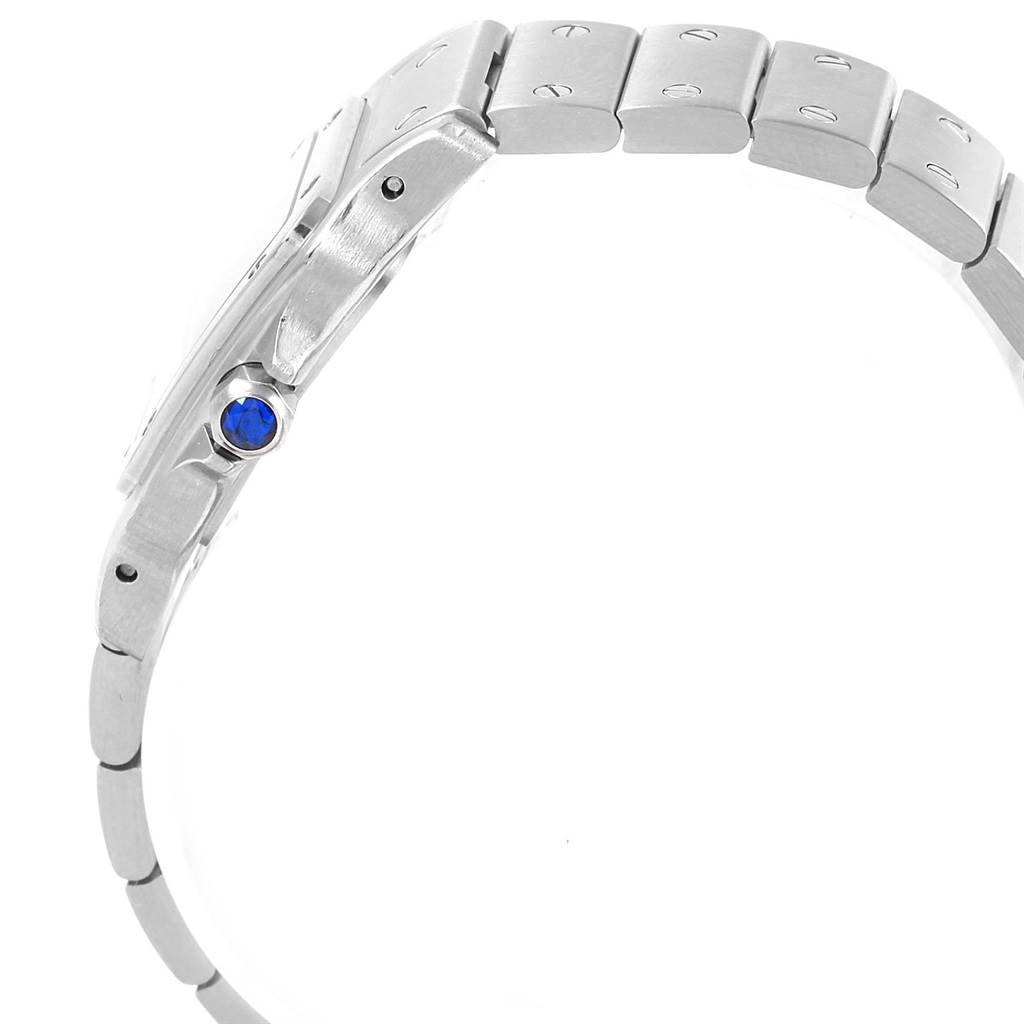 This image shows the side profile of a Santos model watch by Cartier, including the bracelet links and crown with a blue cabochon.