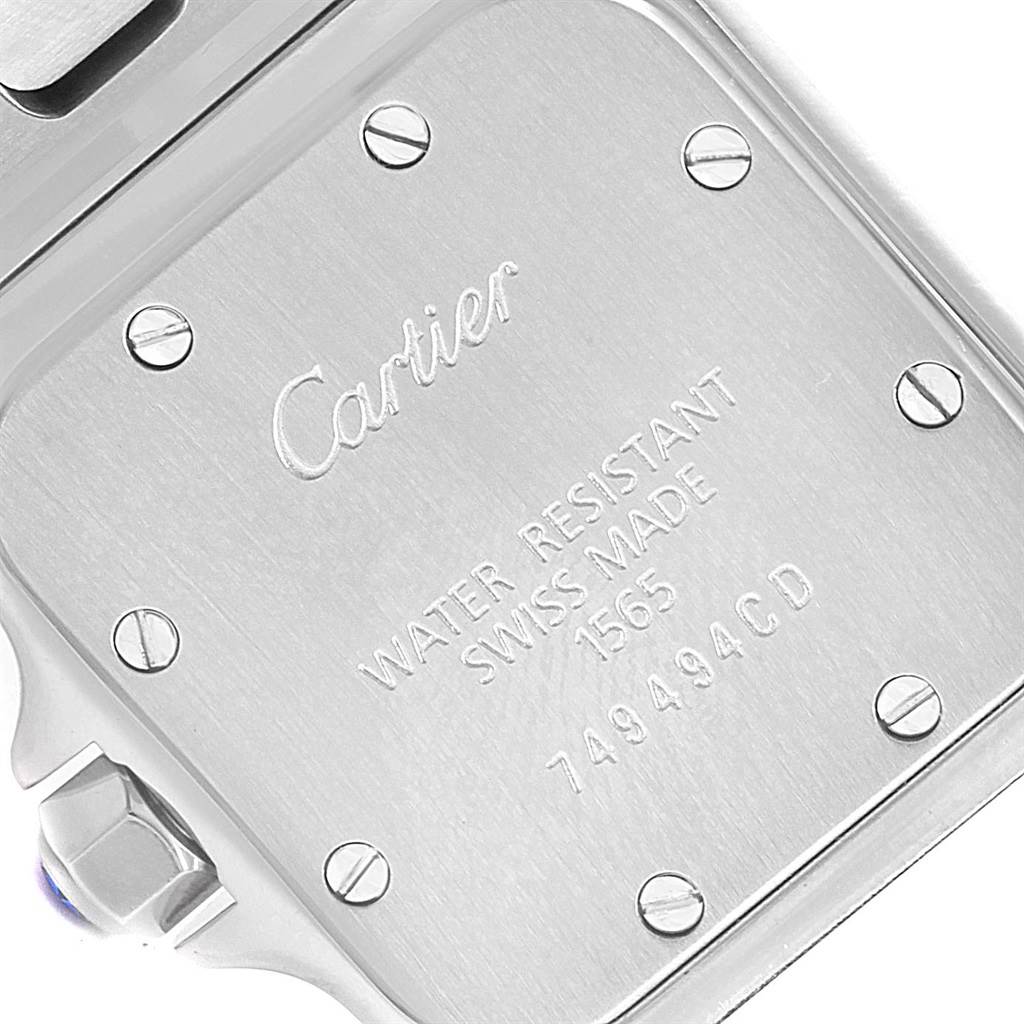 This is the back case of a Cartier Santos W20056D6 Women's Stainless Steel Silver Dial W20056D6 Women's Stainless Steel Silver Dial model watch, showing the engravings and screws.