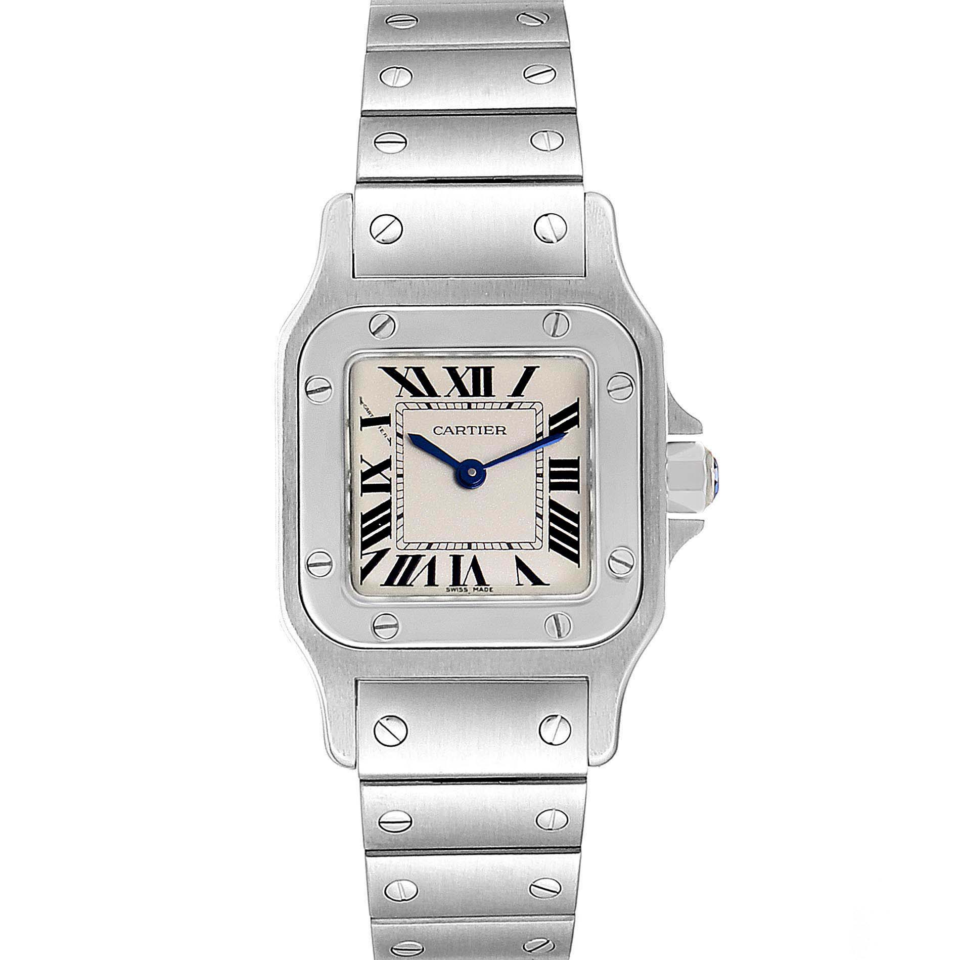 The image shows a straight-on view of a Cartier Santos W20056D6 Women's Stainless Steel Silver Dial W20056D6 Women's Stainless Steel Silver Dial watch, highlighting its face, bezel, crown, and part of the bracelet.