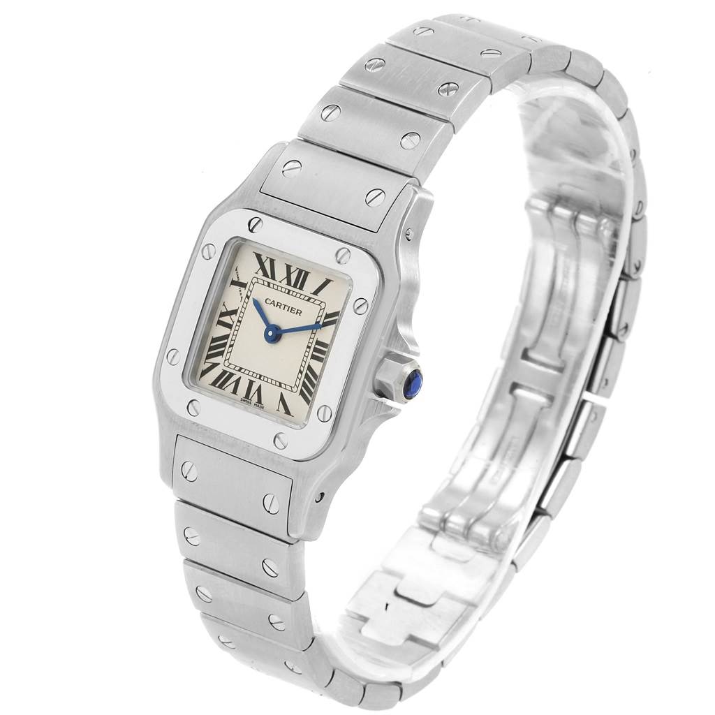 The watch, a Cartier Santos W20056D6 Women's Stainless Steel Silver Dial W20056D6 Women's Stainless Steel Silver Dial, is shown at a side-front angle, displaying its face, bezel, and stainless steel bracelet.