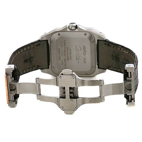 The image shows the back of a Cartier Santos W20107X7 Stainless Steel Silver Dial W20107X7 Stainless Steel Silver Dial model watch, focusing on the case back and the open clasp mechanism.