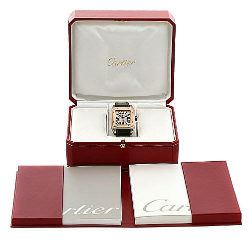 The image shows a Cartier Santos W20107X7 Stainless Steel Silver Dial W20107X7 Stainless Steel Silver Dial model watch in its box, with accompanying booklets laid out in front.