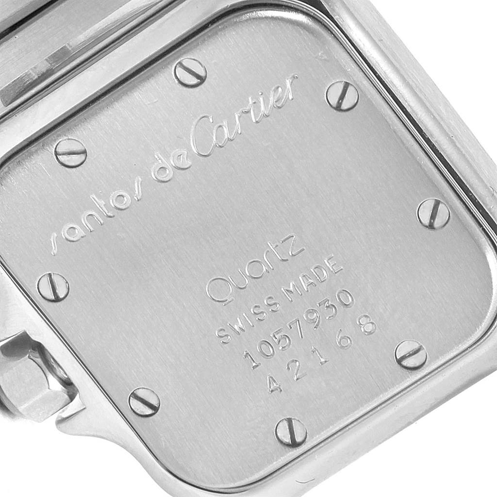 The image shows the back case of the Santos model by Cartier, highlighting its engravings and screws.