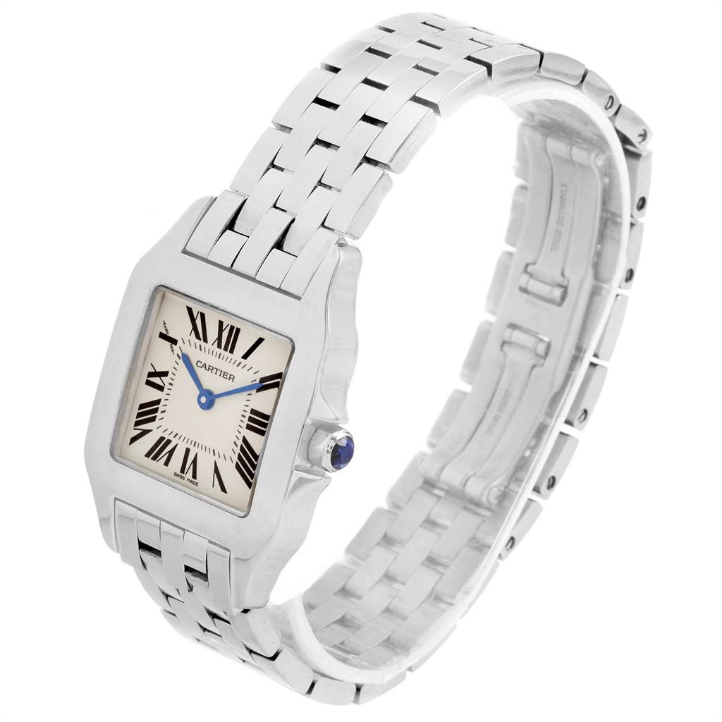 The Cartier Santos W25065Z5 Women's Stainless Steel Silver Dial W25065Z5 Women's Stainless Steel Silver Dial watch is shown from a three-quarter angle, highlighting the square dial, Roman numerals, and metal bracelet.