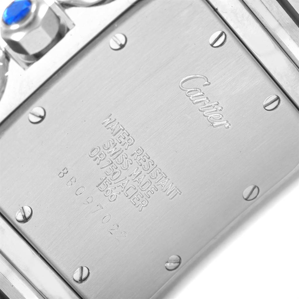 The image shows the backside of a Cartier Santos W20011C4 Stainless Steel Silver Dial W20011C4 Stainless Steel Silver Dial watch, displaying its engraved details and screws.