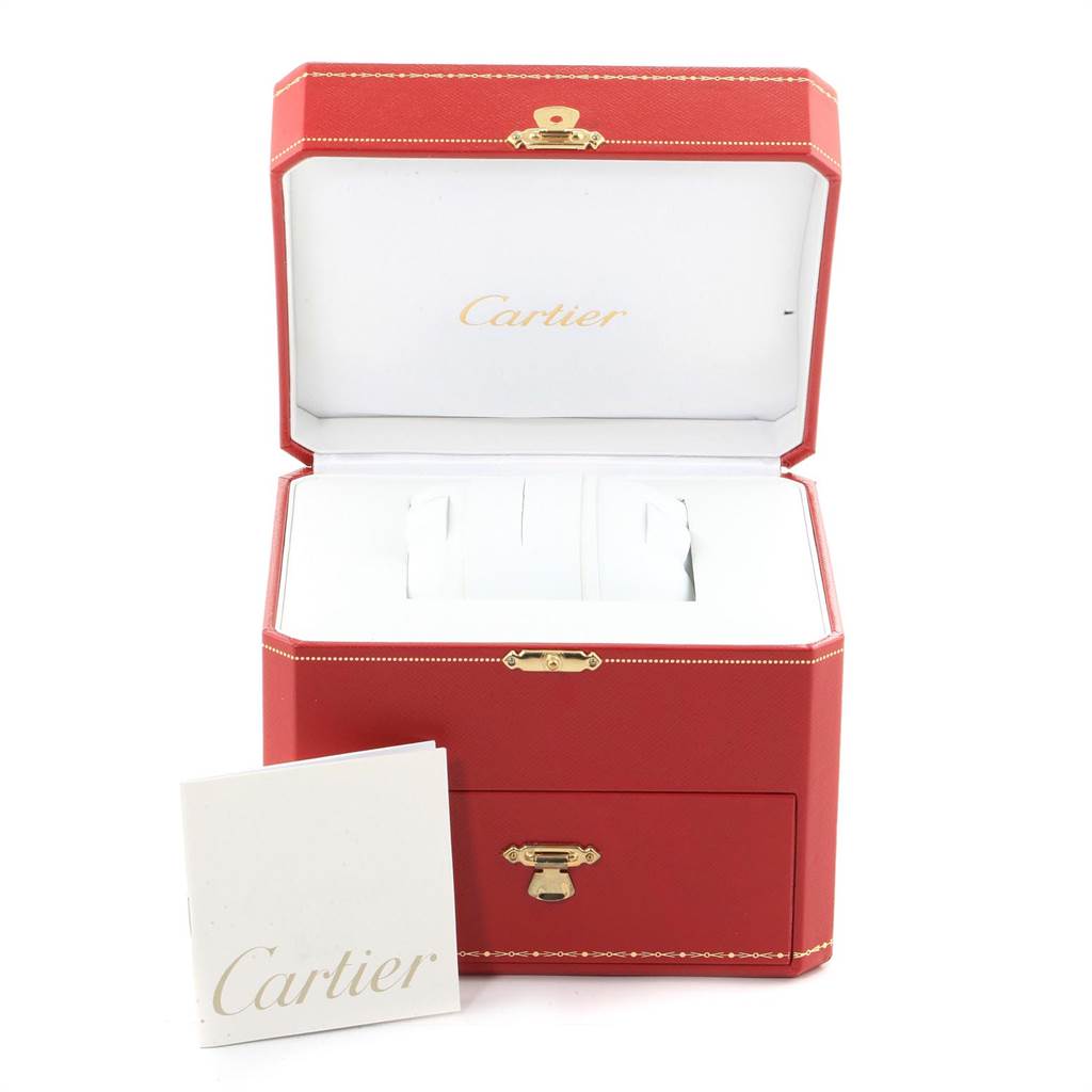 The image shows an open red Cartier Santos W20012C4 Women's Stainless Steel Silver Dial W20012C4 Women's Stainless Steel Silver Dial watch box and an accompanying booklet placed in front.