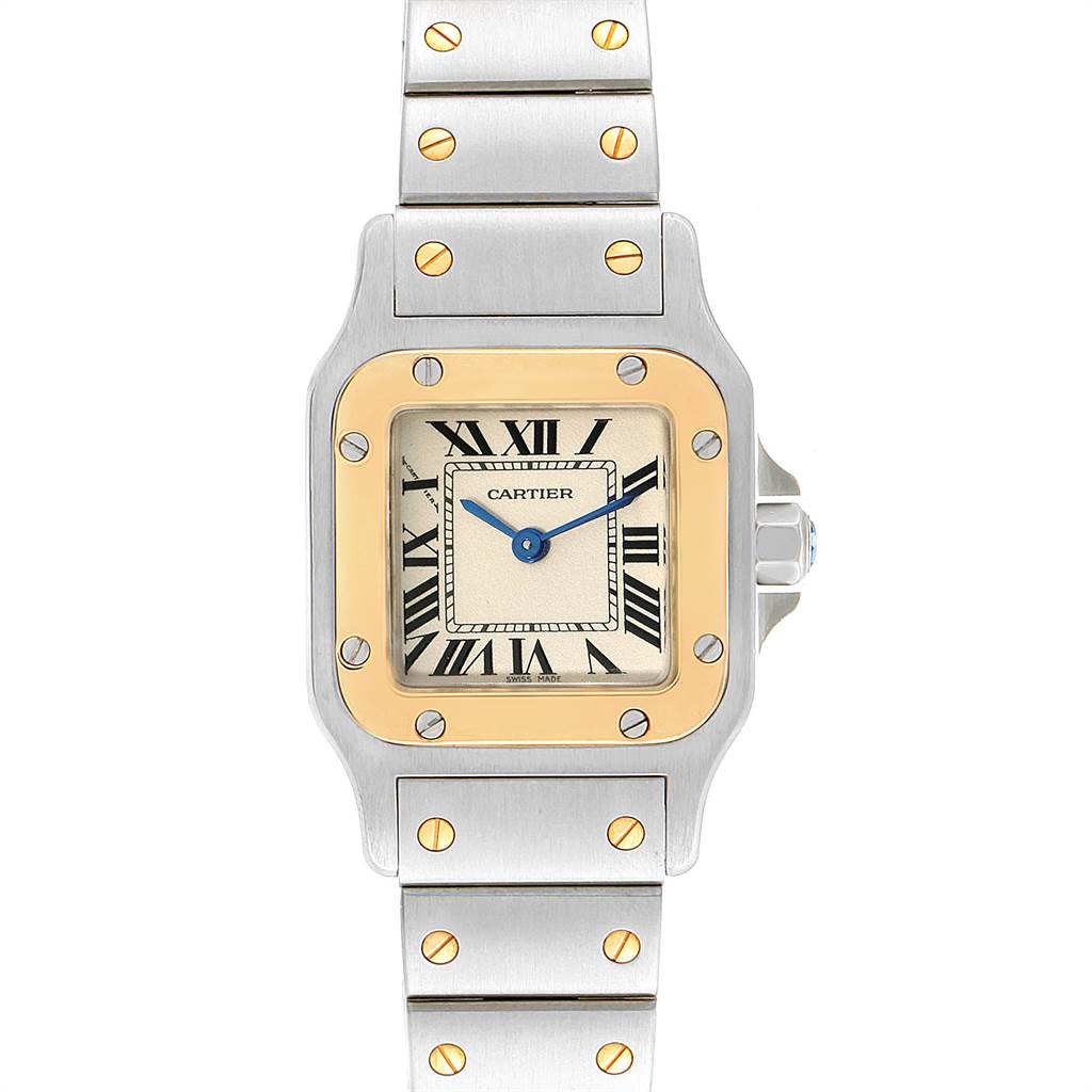 The image shows a front view of a Cartier Santos W20012C4 Women's Stainless Steel Silver Dial W20012C4 Women's Stainless Steel Silver Dial watch, highlighting its square dial, gold bezel, and metal bracelet.