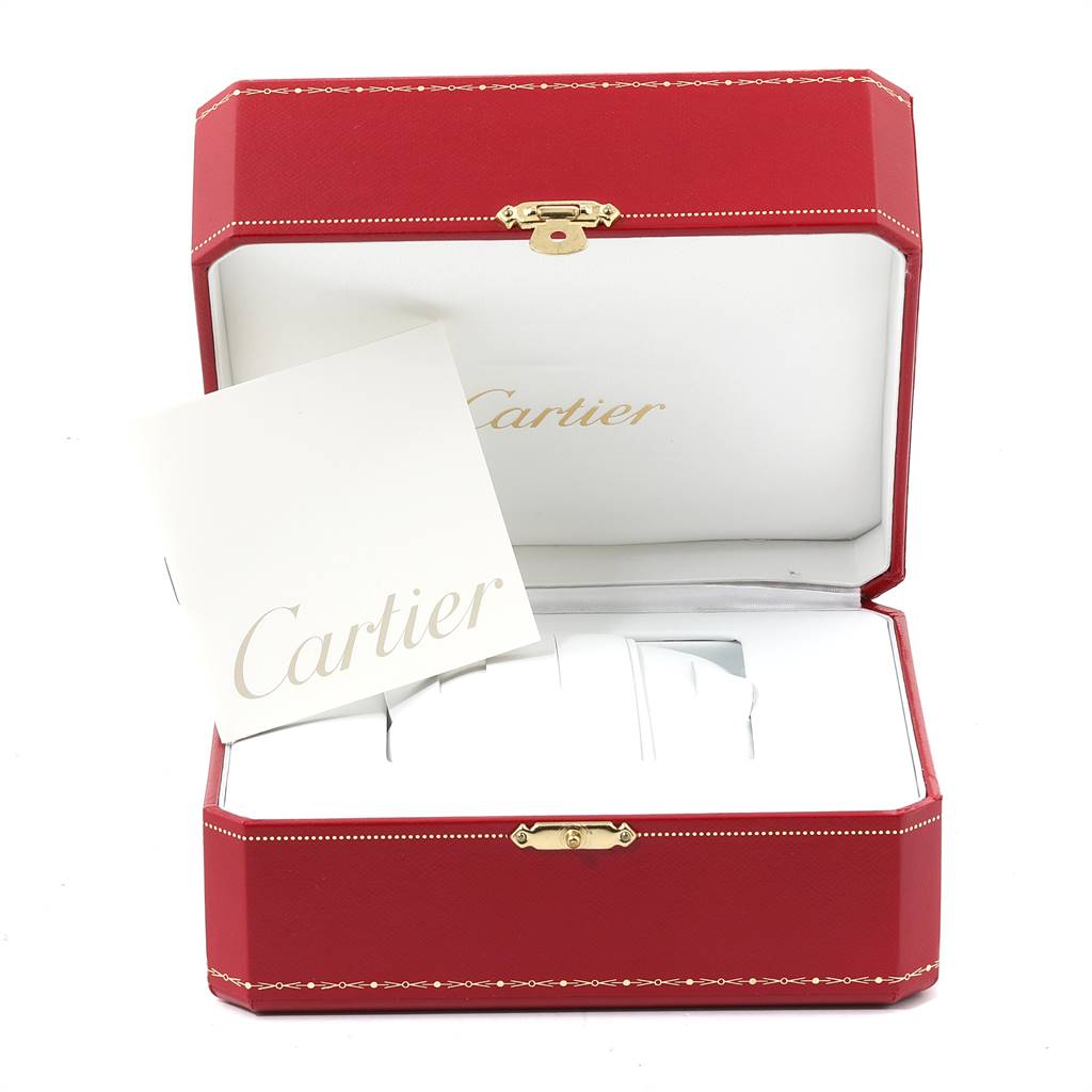 The image shows a red Cartier box with an open lid and a Cartier booklet inside, for the Santos model watch by Cartier.