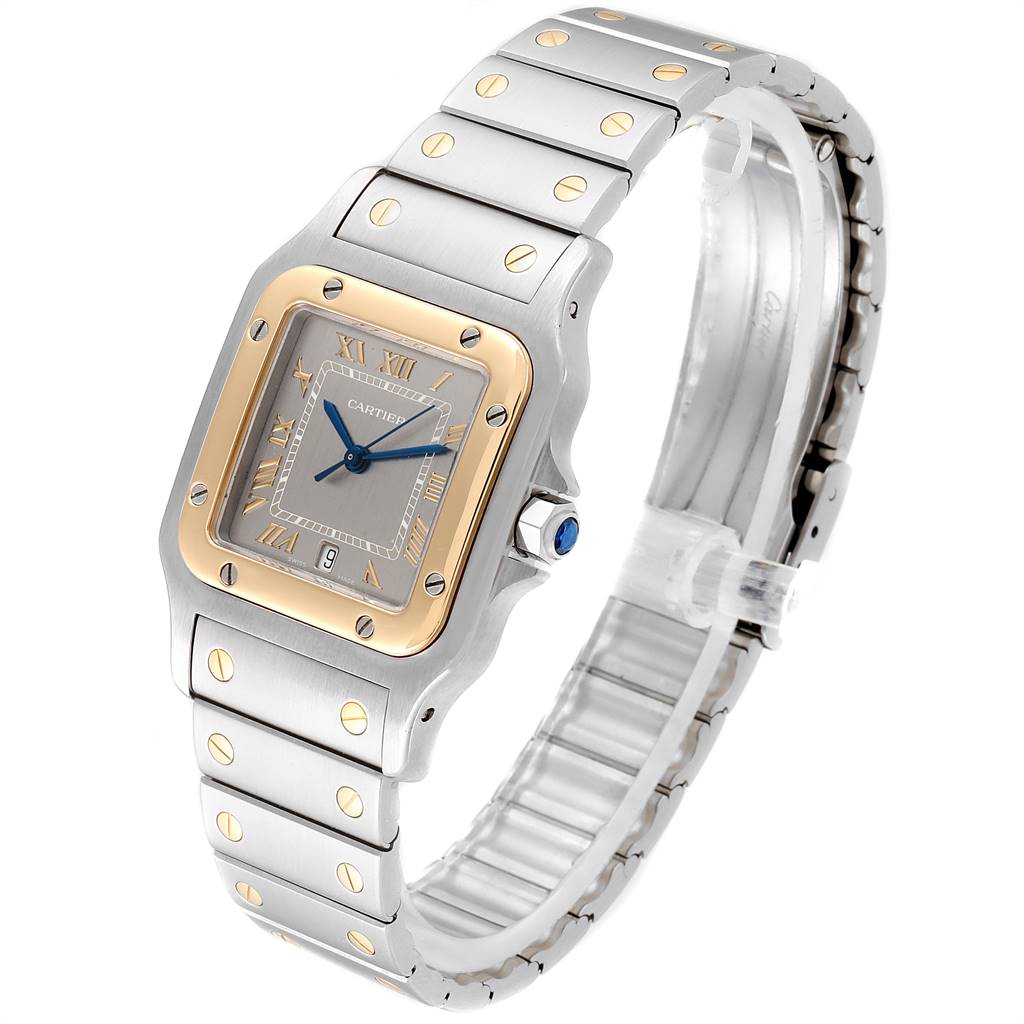 The Santos model by Cartier is shown at a three-quarter angle, highlighting its metal bracelet and square face with Roman numerals.