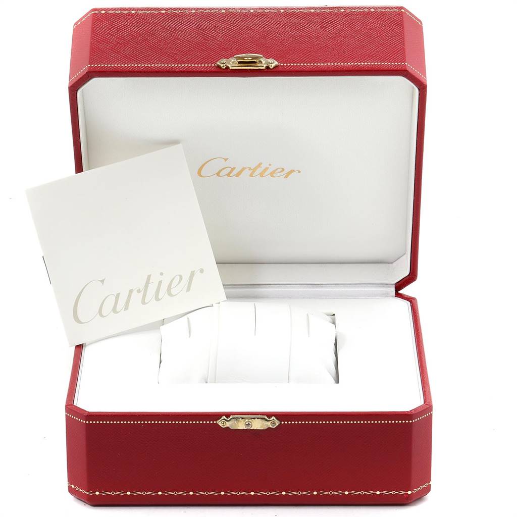 This image shows an open Cartier Santos 1565 Women's Stainless Steel Silver Dial 1565 Women's Stainless Steel Silver Dial watch box with white cushions and a booklet inside.