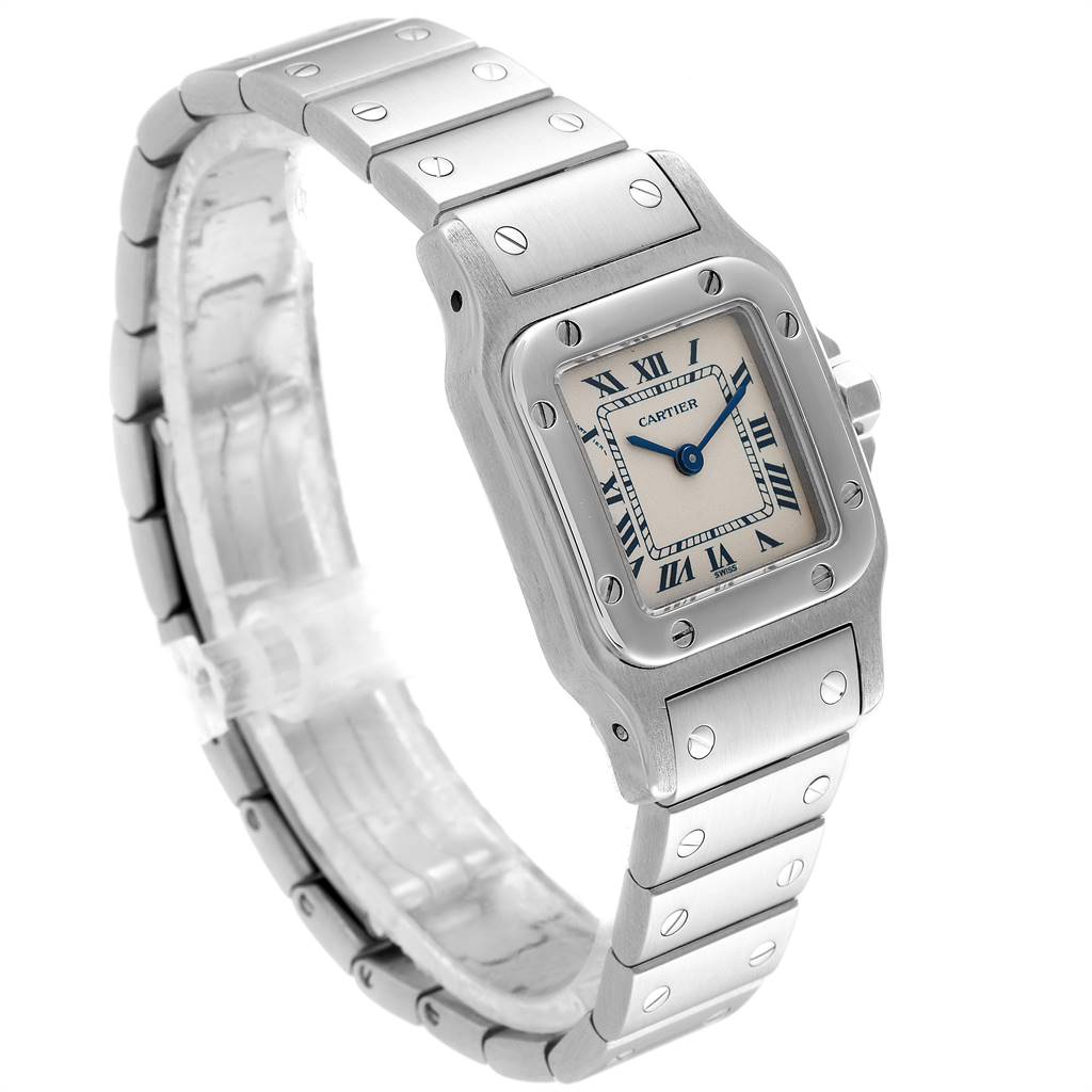 The image shows a Cartier Santos 1565 Women's Stainless Steel Silver Dial 1565 Women's Stainless Steel Silver Dial watch at an angle highlighting its face, bezel, and metal bracelet.