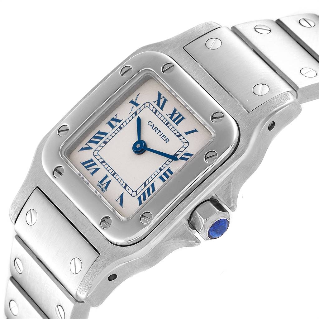 This image shows a close-up angle of the face and part of the stainless steel bracelet of a Santos model by Cartier.