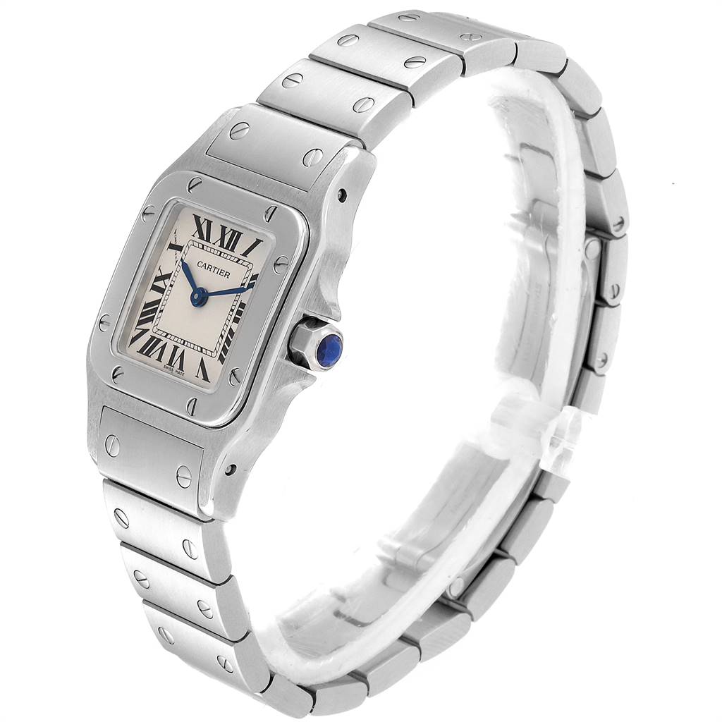 The Cartier Santos W20056D6 Women's Stainless Steel Silver Dial W20056D6 Women's Stainless Steel Silver Dial watch is shown at an angle highlighting its rectangular face, Roman numerals, and metal bracelet with visible screws.