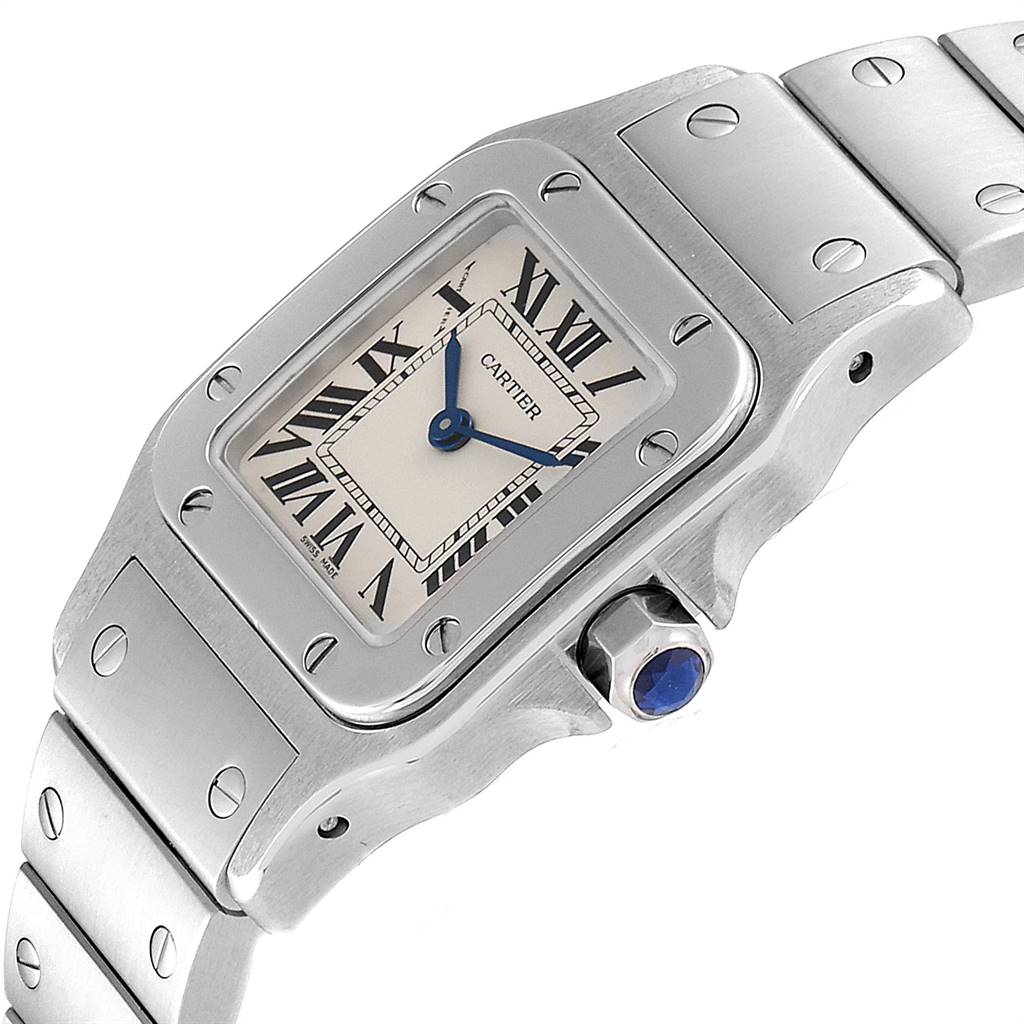 The image shows a close-up of the Cartier Santos W20056D6 Women's Stainless Steel Silver Dial W20056D6 Women's Stainless Steel Silver Dial watch, highlighting its face, bezel, crown, and part of the bracelet.