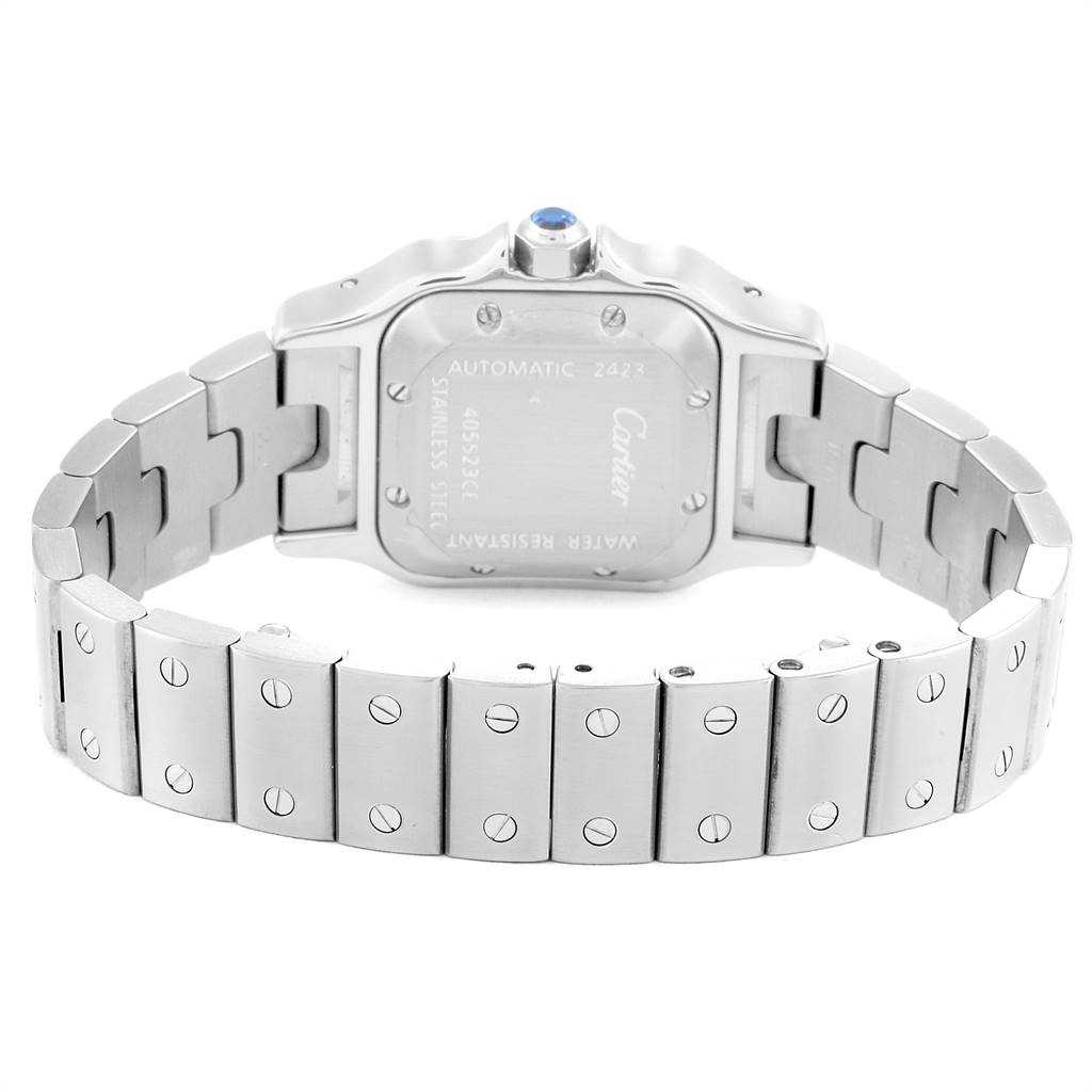 The image shows the back view of a Santos model by Cartier, highlighting the stainless steel case and bracelet.