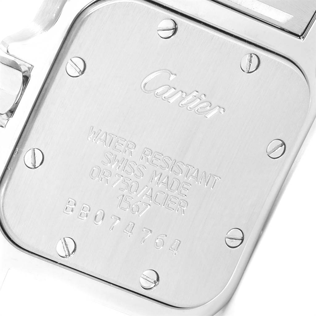 This is the back casing of a Cartier Santos W20012C4 Women's Stainless Steel Silver Dial W20012C4 Women's Stainless Steel Silver Dial watch, showing the engraved details and screws.
